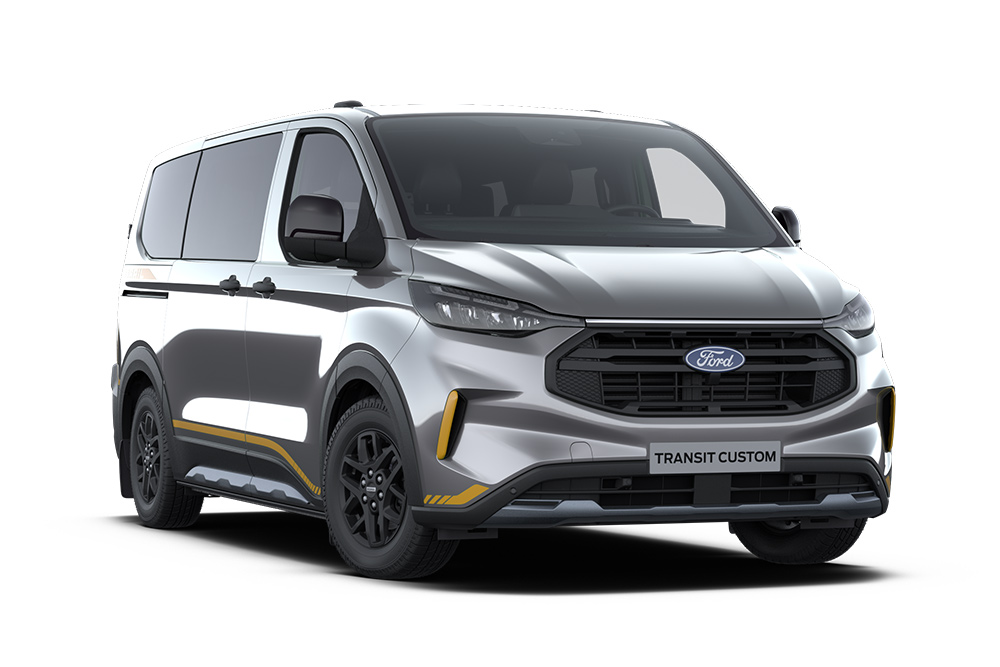 Mørkegrå Trail Ford Transit Custom-varebil med gullfargede detaljer.